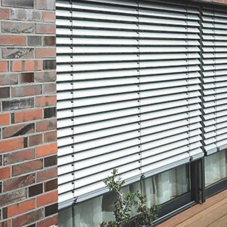 ROMA External Venetian Blinds at Brick House Close-up window outside by daylight, external venetian blinds, tilting position closed