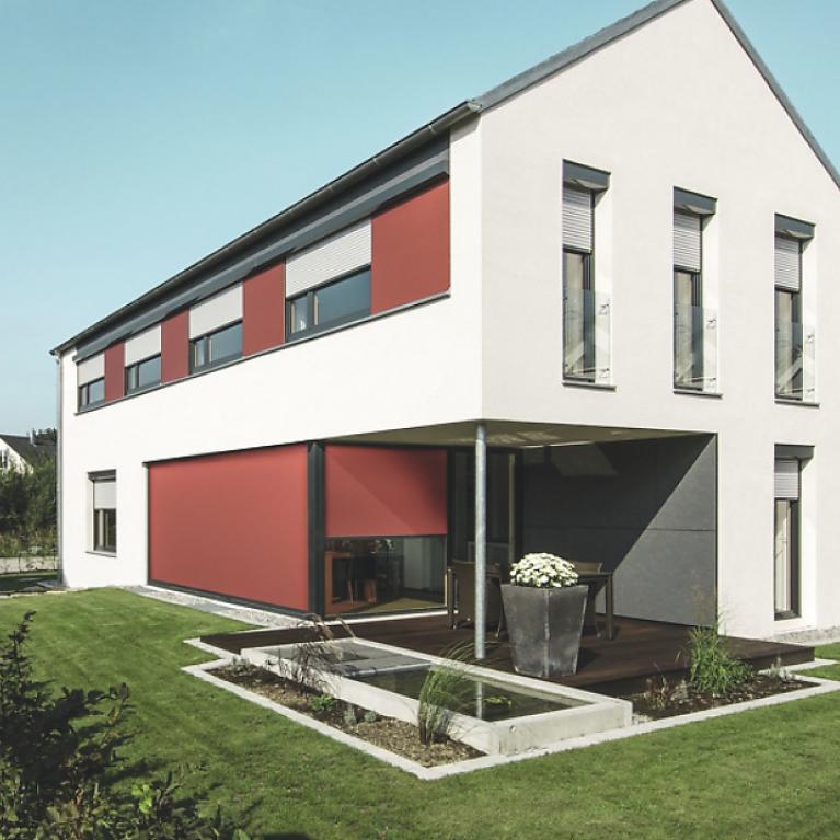 Residential Building Langenargen Residential building detail with slightly lowered textile screens by daylight