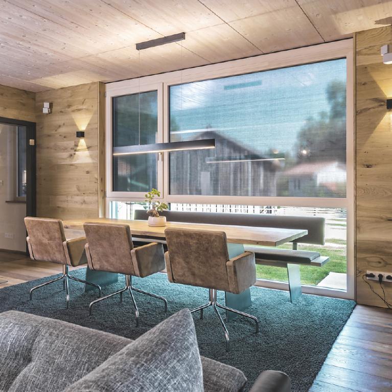 Single-Family Home Jettingen-Scheppach Living/dining room with view to window with half closed textile screens